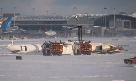 Plane Flips Over in Toronto, and Migrants Trapped in Panama Hotel