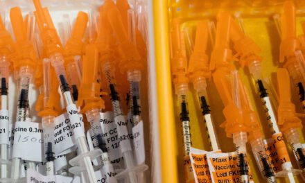 F.D.A. Official Overruled Scientists on Wide Access to Covid Shots